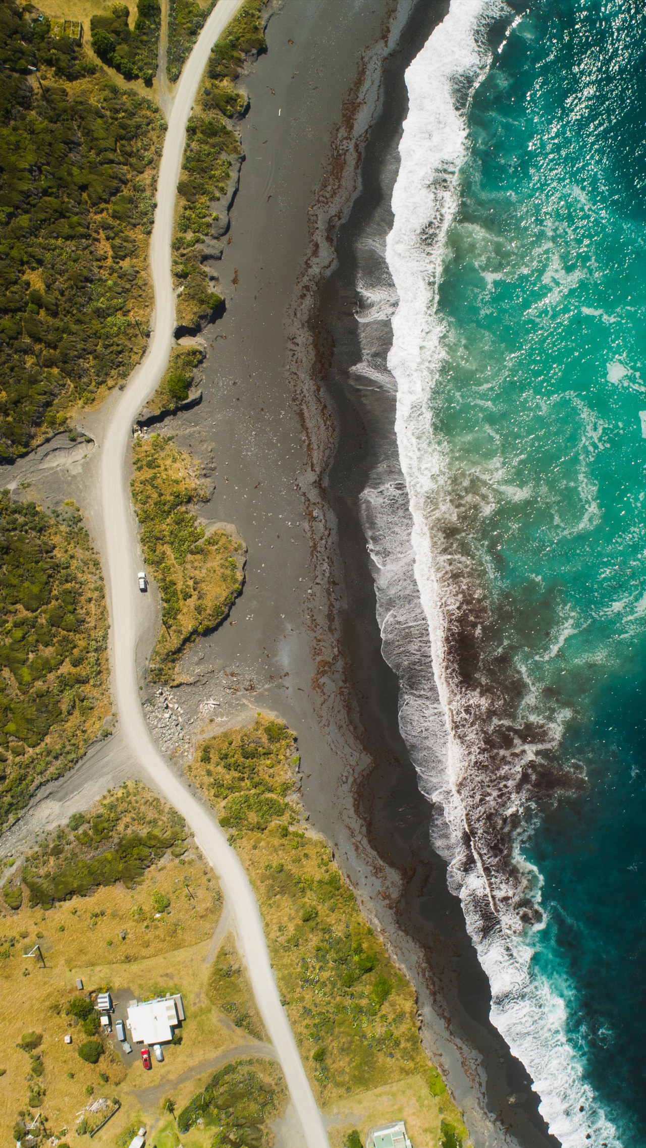 road-on-coastline-aerial-view-getty-1301153296_VERTICAL.png