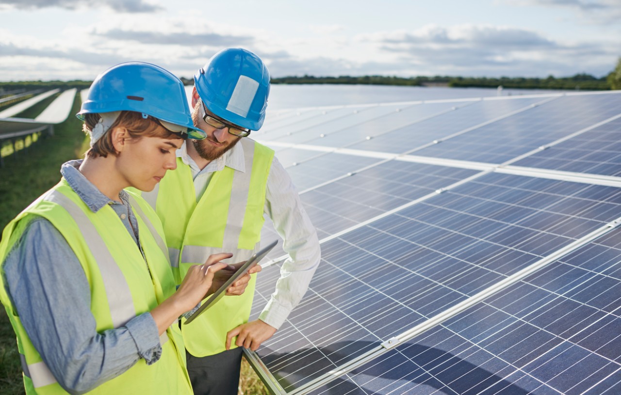 engineers-w-tablet-at-solar-farm-getty-588551165.jpg