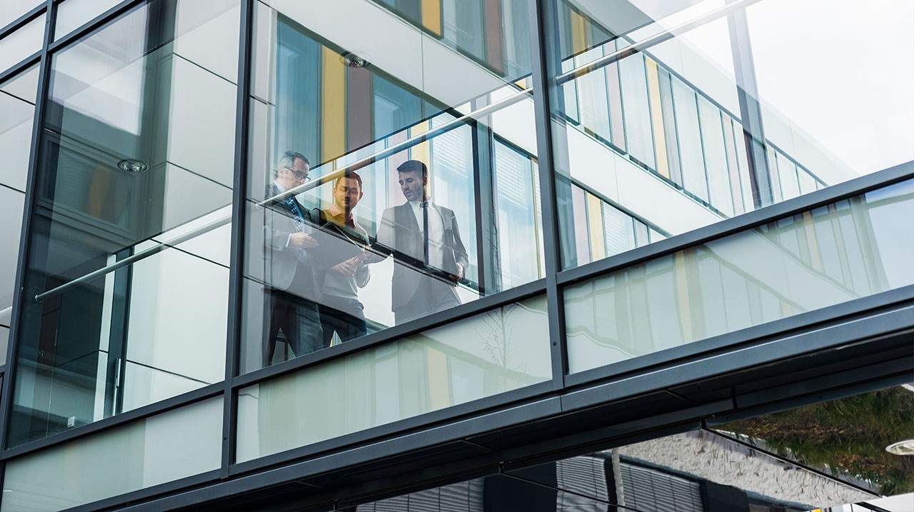 businessmen-in-glass-office-building.jpg