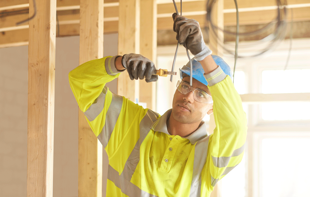 electrician-working-on-home-construction-1206538384.png