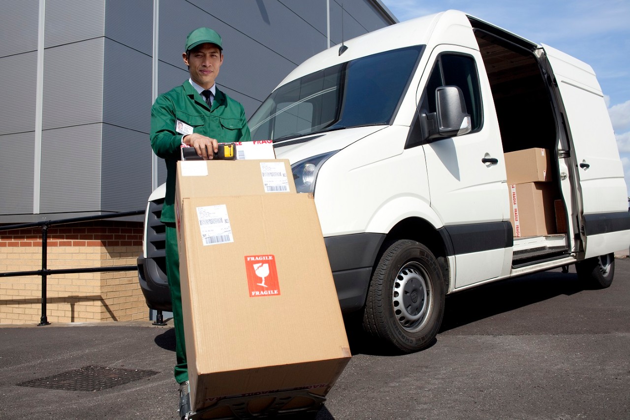 delivery-worker-w-white-delivery-van-getty-102428873.jpg